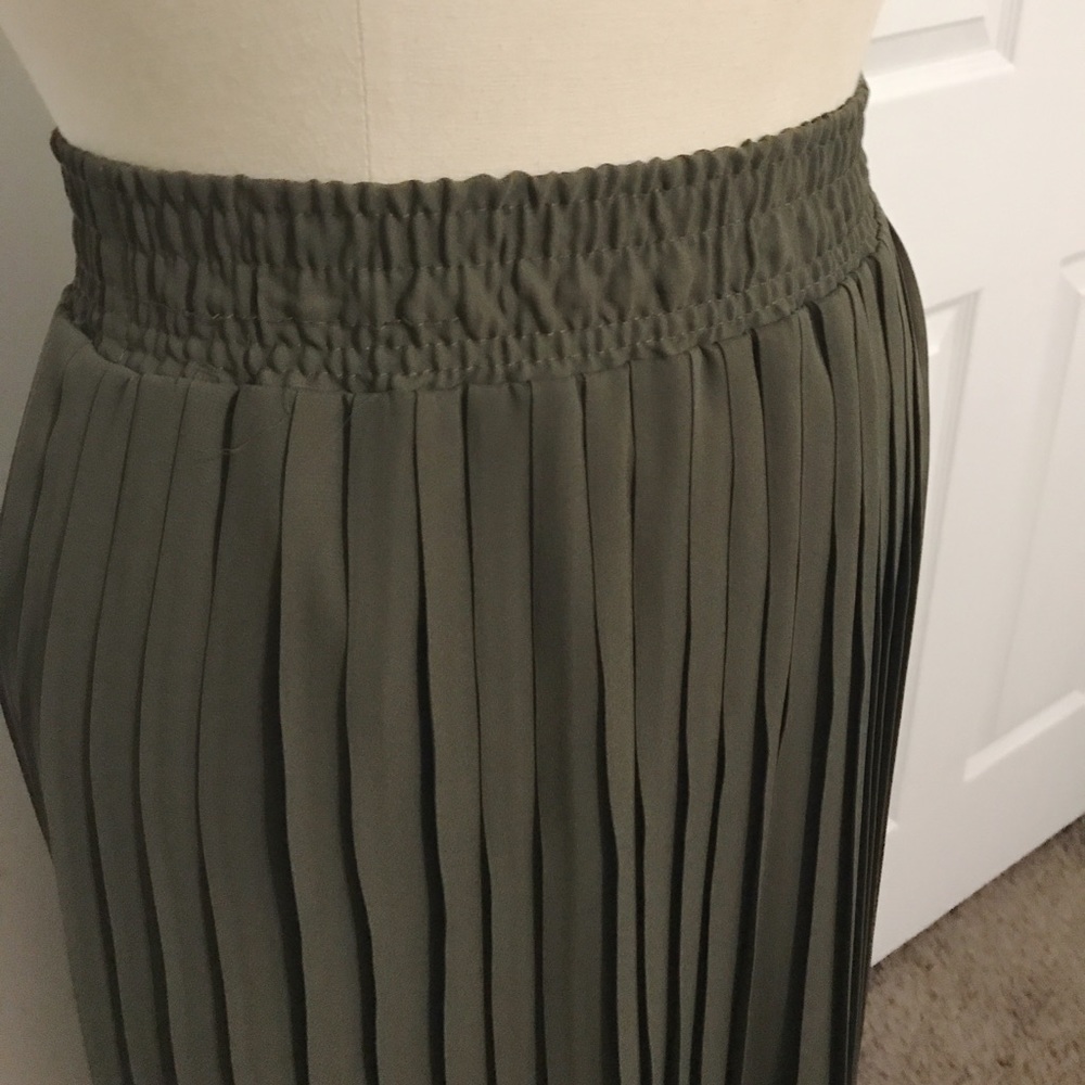 Green pleated skirt